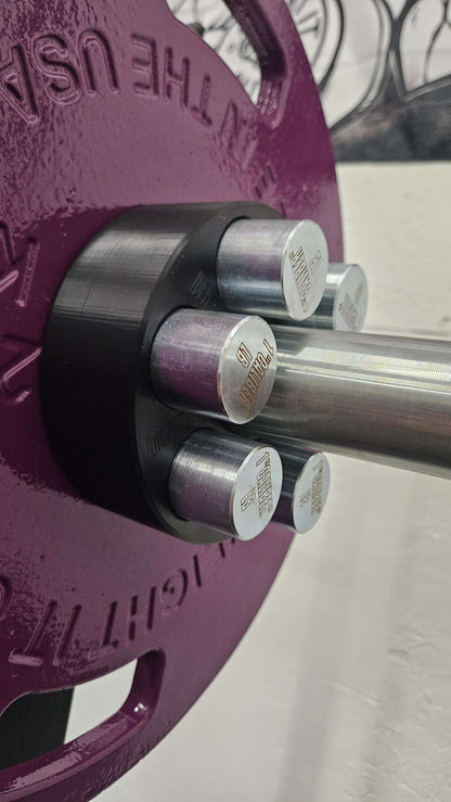 Lock And Load Revolver Micro Loading Plates - front view close up on the barbell