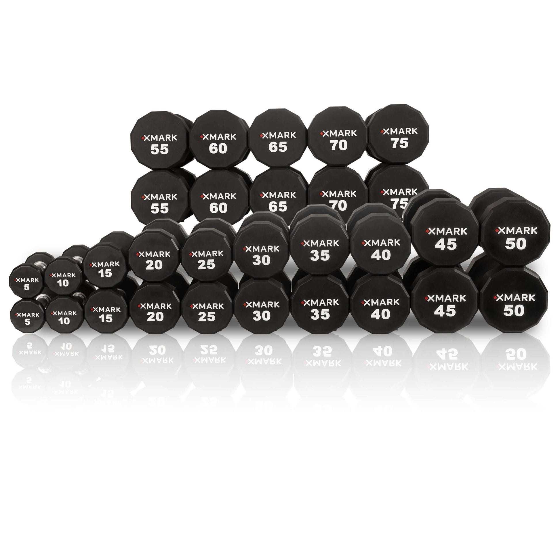 Collection of XMARK 12-sided urethane dumbbells ranging from 5 to 75 lbs, featuring clear weight markings and a sturdy design.
