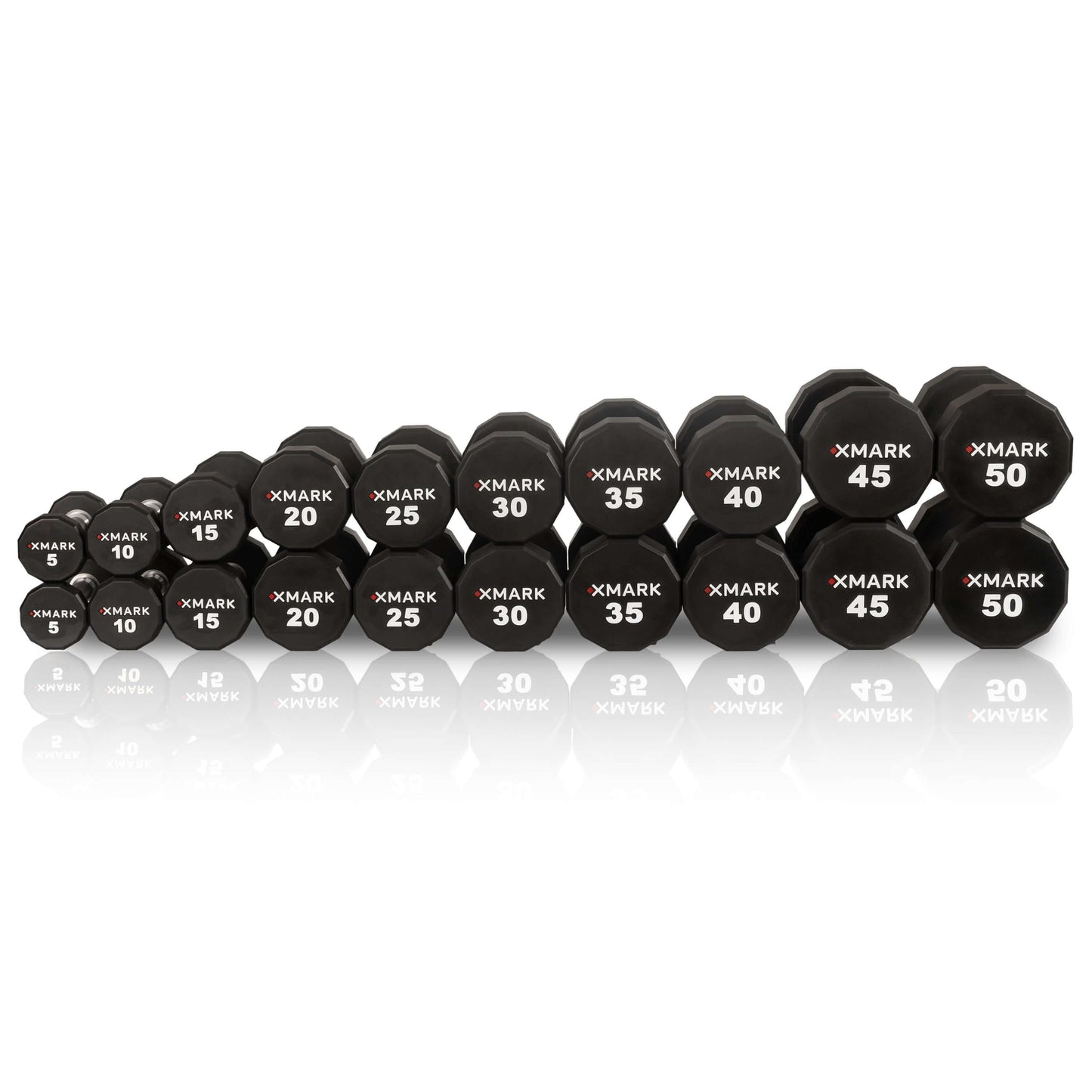 XMARK 12-sided commercial urethane dumbbells ranging from 5 to 50 lbs lined up for gym workouts.