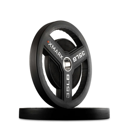 XMARK Commercial Urethane Olympic Weight Plates, featuring tri-grip handles and a durable 35 lb design.