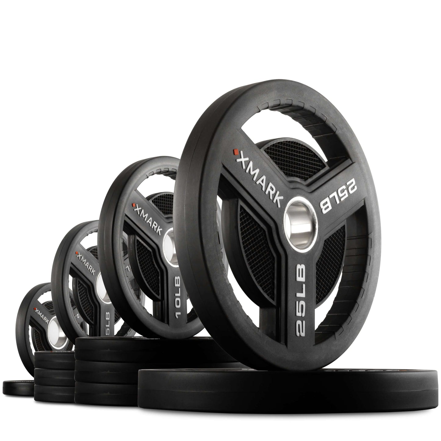 Commercial urethane Olympic weight plates by XMARK in various weights, featuring tri-grip handles for easy use.