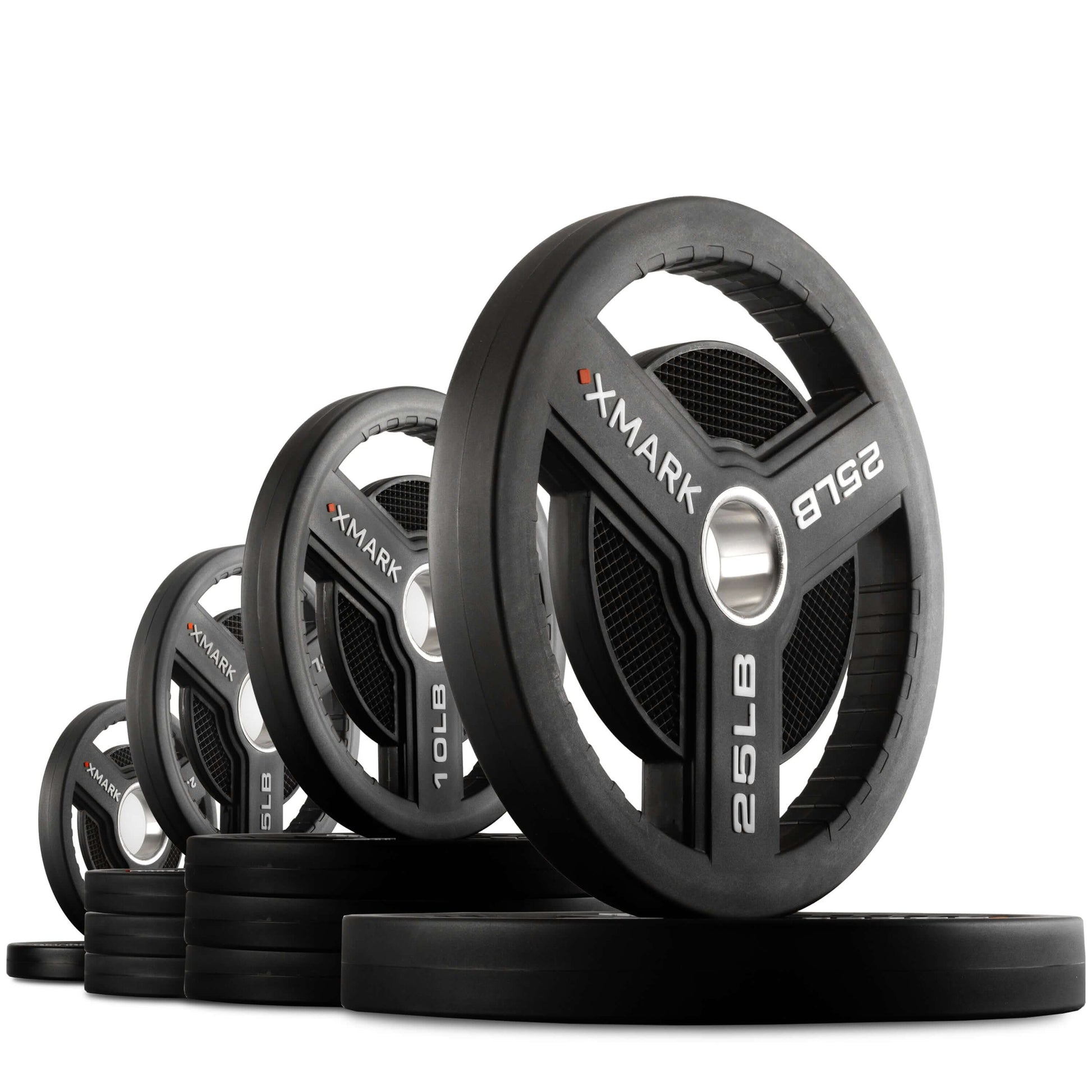 Commercial urethane Olympic weight plates by XMARK in various weights, featuring tri-grip handles for easy use.