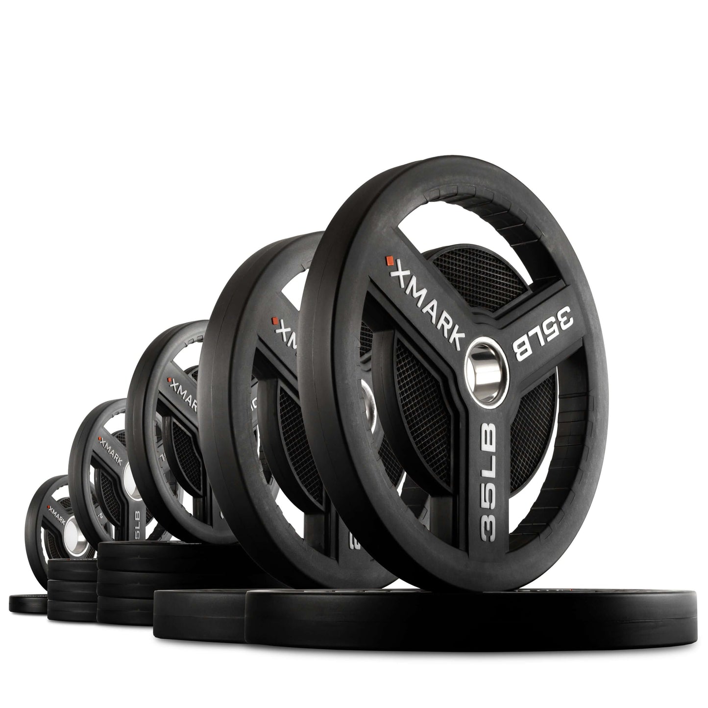 Line of XMARK Commercial Urethane Olympic Weight Plates with tri-grip handles, showcasing durability and precision.