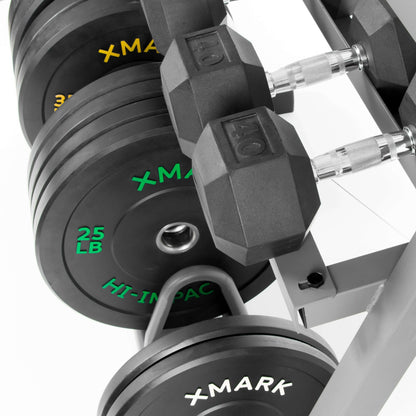 Close-up of XMark storage rack holding 25 lb weights and dumbbells, showcasing rugged construction for gym organization.