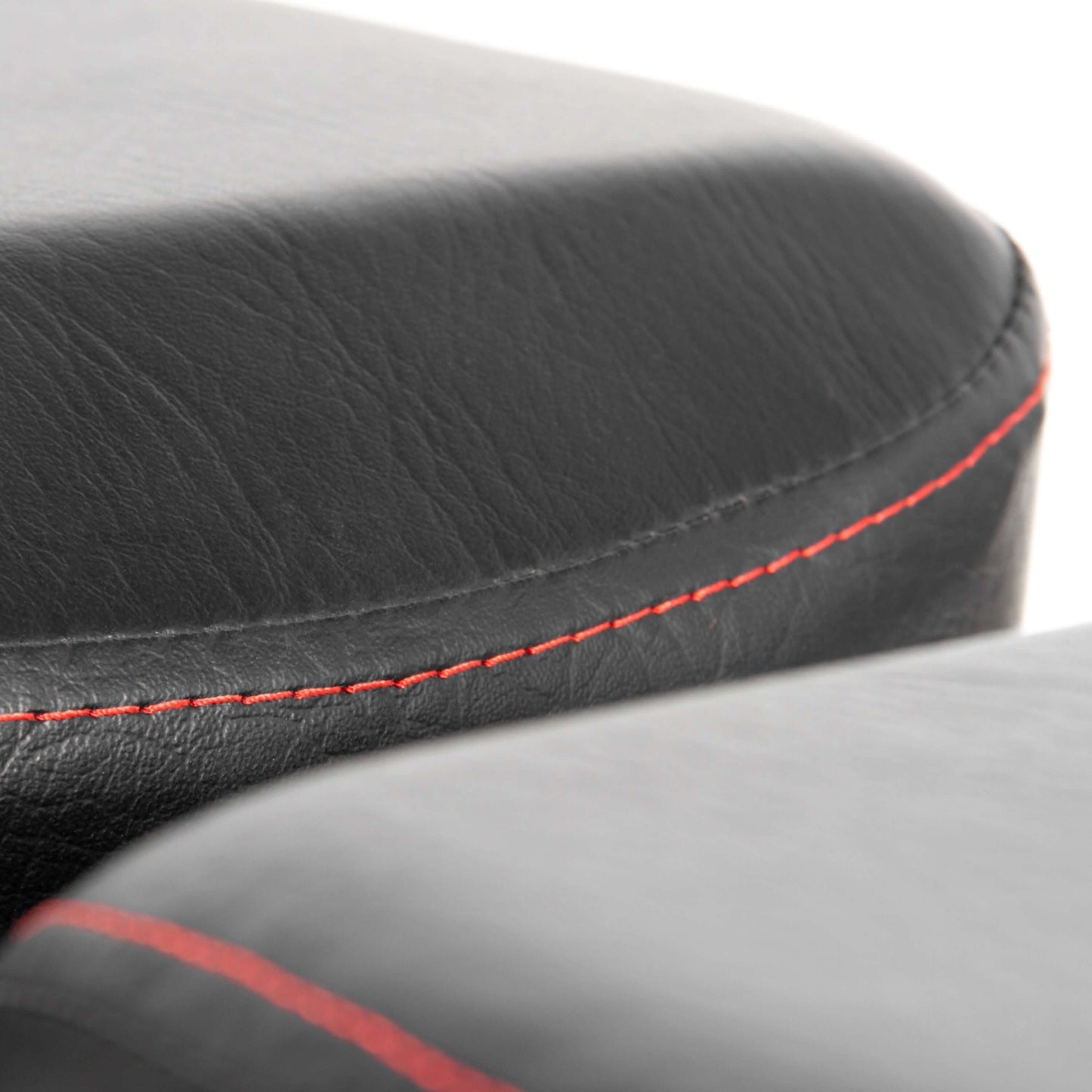 Close-up of the power series adjustable dumbbell weight bench padding with black leather and red stitching detail.