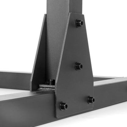 Detail of heavy-duty steel construction and support brackets of the adjustable squat rack bench press.