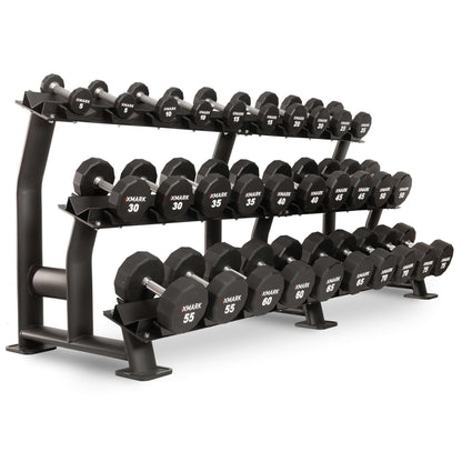XMARK 12-sided urethane dumbbells on a rack, featuring clear weight markings for easy identification.