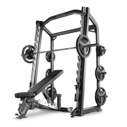 XMARK Commercial Smith Machine with adjustable bench, weights, and safety catches for effective strength training.