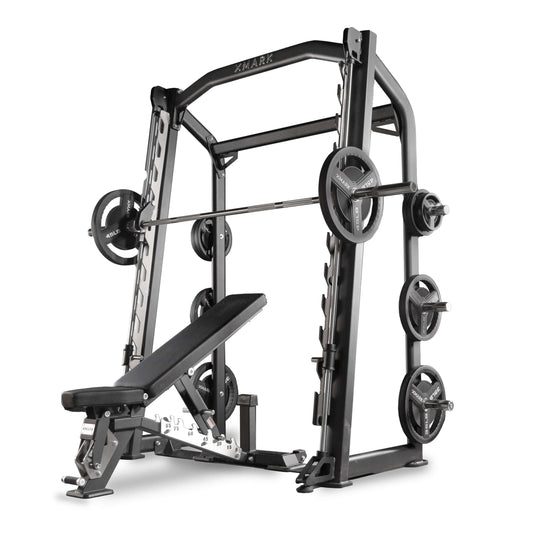 XMARK Commercial Smith Machine with adjustable bench, weights, and safety catches for effective strength training.