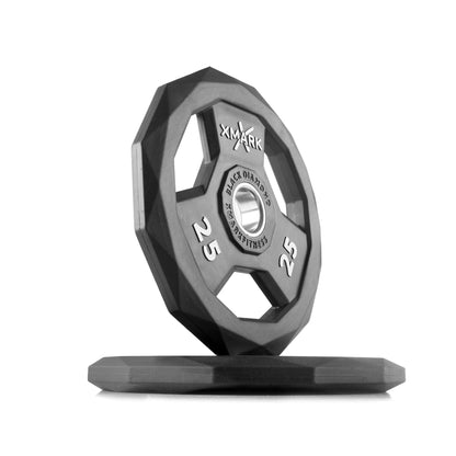 Black Diamond Olympic weight plate with a unique design, solid cast iron core, and durable rubber encasing for gym use.