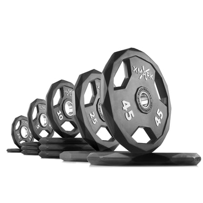 Black Diamond Olympic weight plates in various sizes from 10 to 45 pounds, showcasing premium rubber encasing for durability.