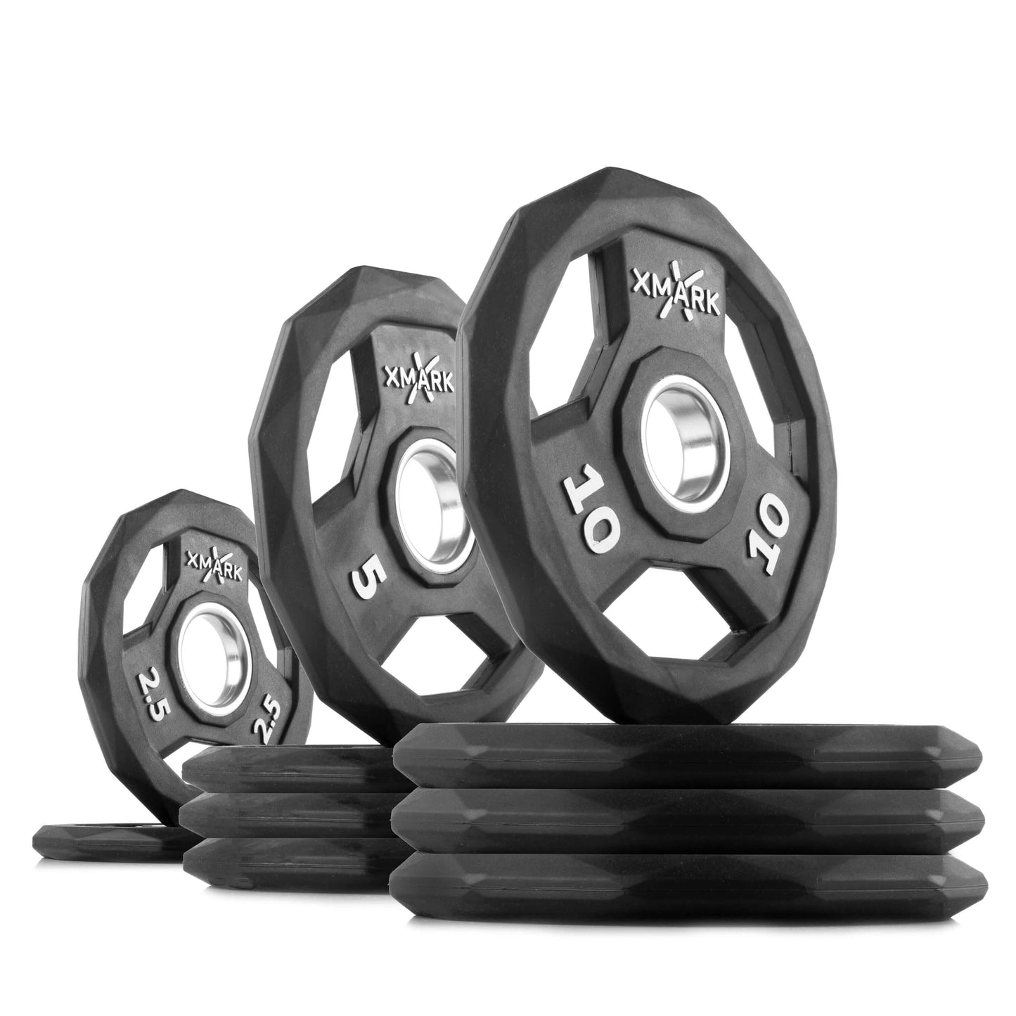 Set of XMARK weight plates in black rubber, ranging from 2.5 to 10 lbs, featuring unique octagonal design for versatile gym use.