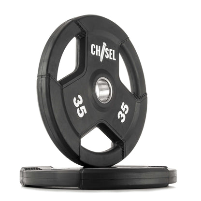 Chisel Olympic weight plates, 35 lbs each, featuring recessed tri-grip handles, rubber-encased design for easy lifting.