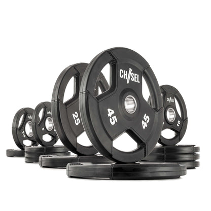 Chisel Olympic weight plates in various sizes, featuring tri-grip handles for easy lifting and a rubber-encased design.