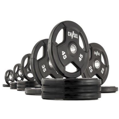 Chisel Olympic weight plates displayed in various weights, featuring tri-grip handles and a rugged rubber design.