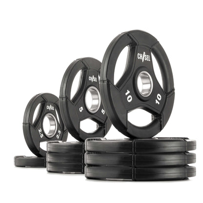 Chisel Olympic weight plates in various sizes with recessed tri-grip handles for easy lifting.