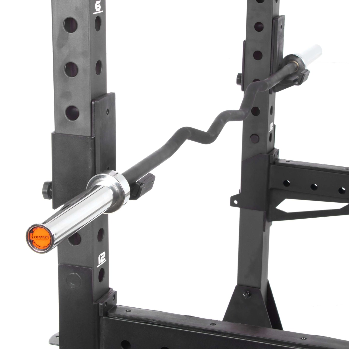 Close-up of a Convict rackable curl bar fitted in a power rack, showcasing its durable design and knurled grip.