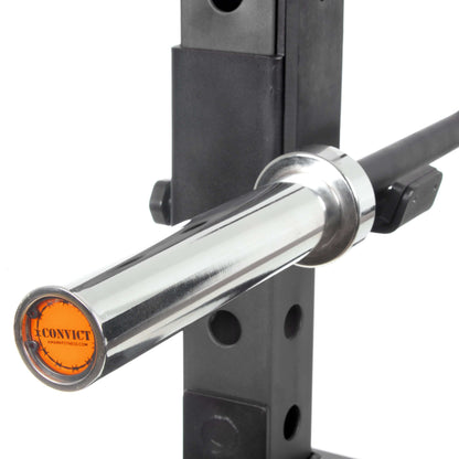 Close-up of the Convict rackable curl bar's chrome shaft and grip, designed for power racks for enhanced workout versatility.