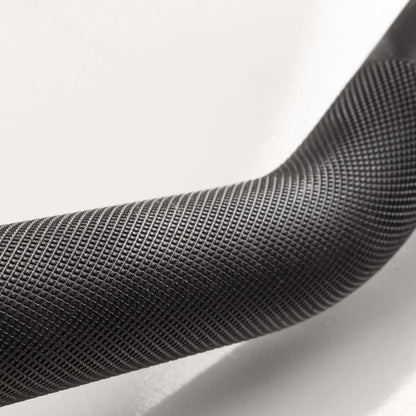 Close-up of the textured handle of the Crowbar EZ Curl Barbell, showcasing ergonomic grip for comfortable lifting.