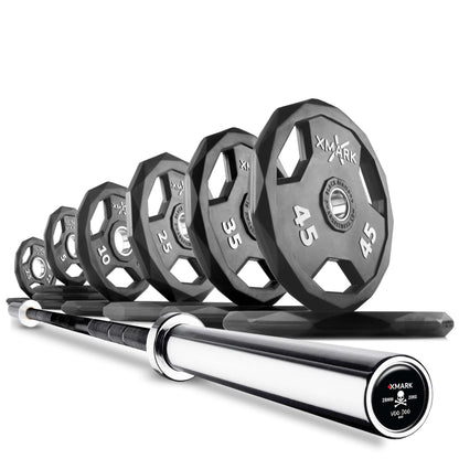 Olympic weight plates in various weights lined up with a shiny Olympic barbell, perfect for strength training and fitness.