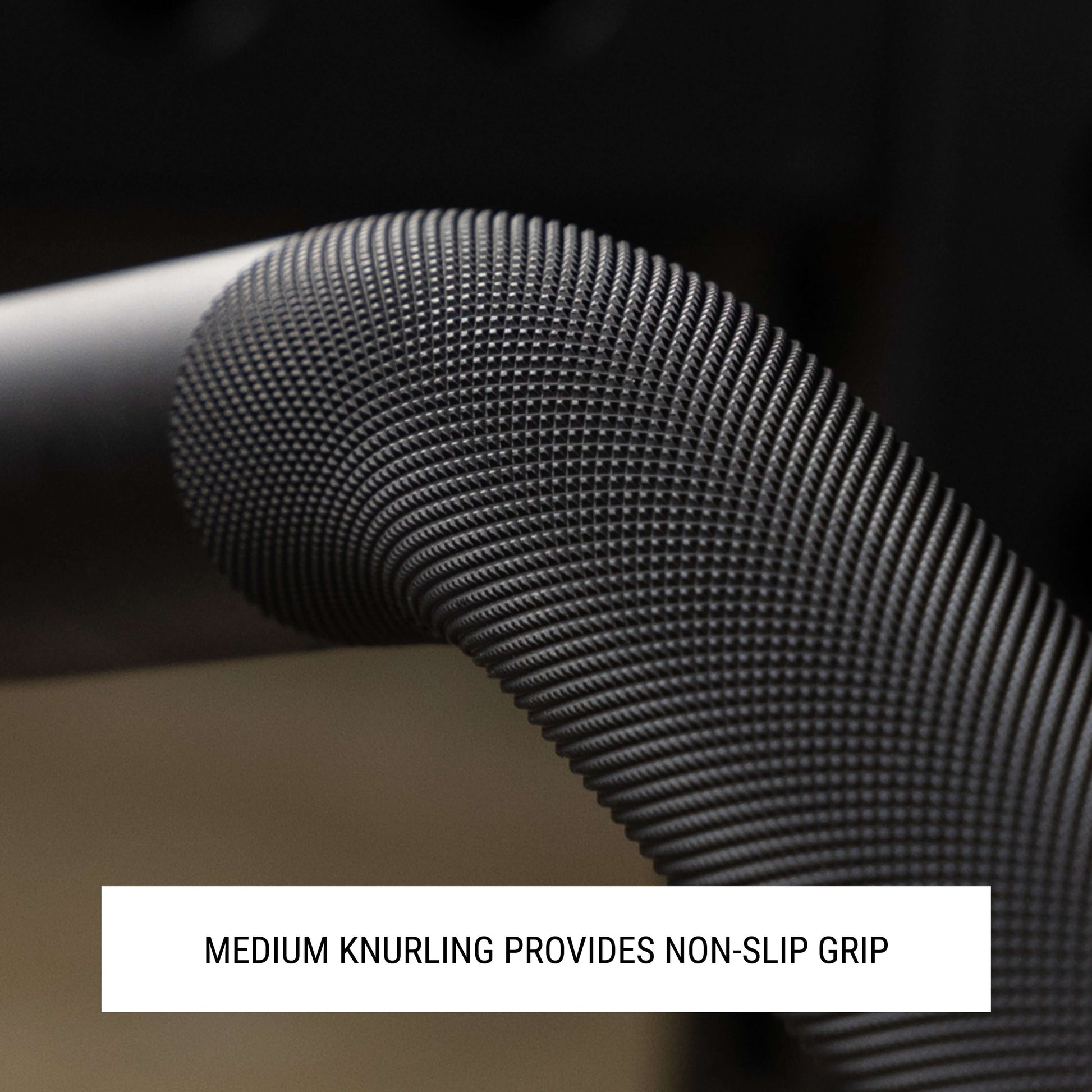 Close-up of rackable curl bar's knurled grip, showcasing medium knurling for a secure, non-slip hold during workouts.