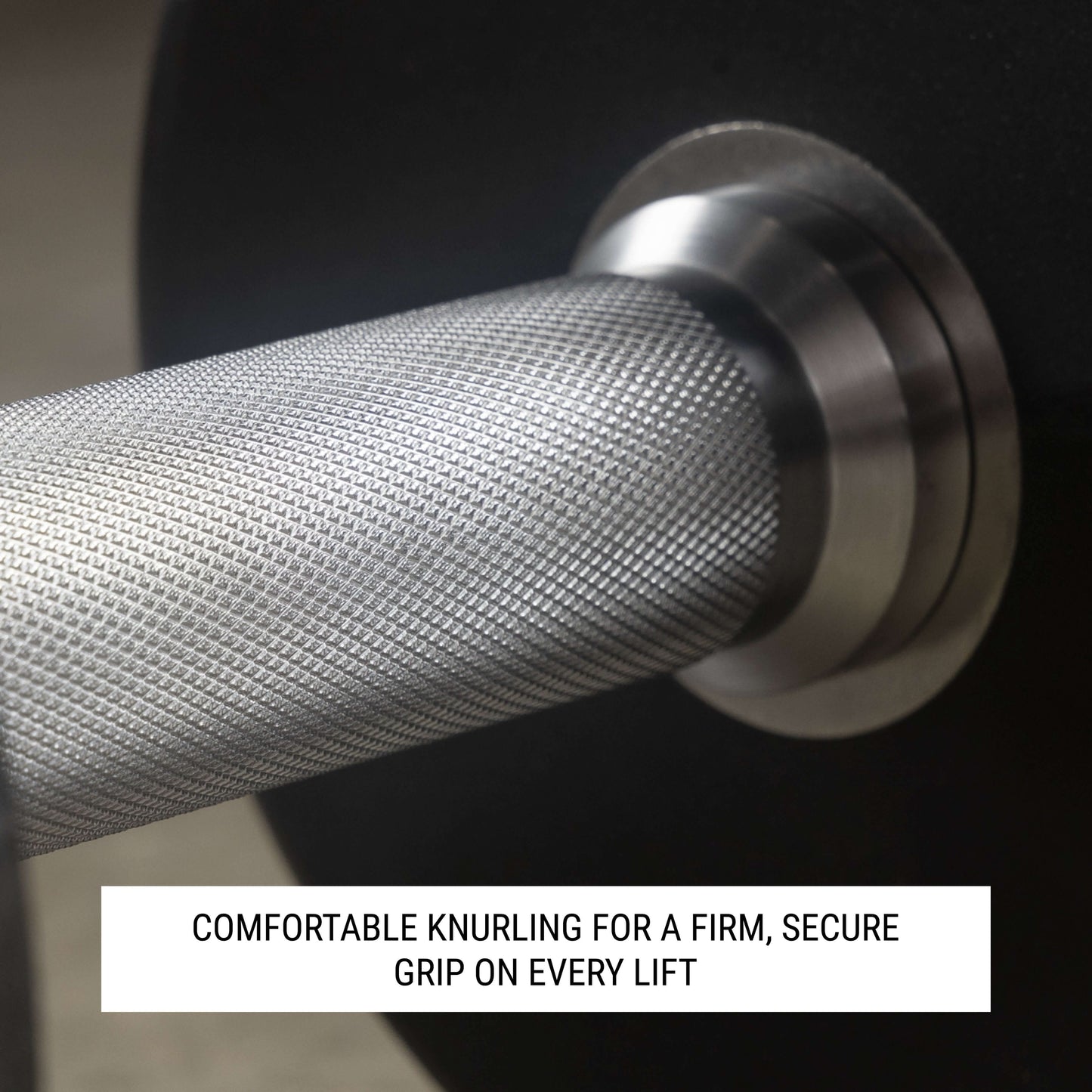 Close-up of dumbbell handle showing knurling design for a secure grip during strength training.