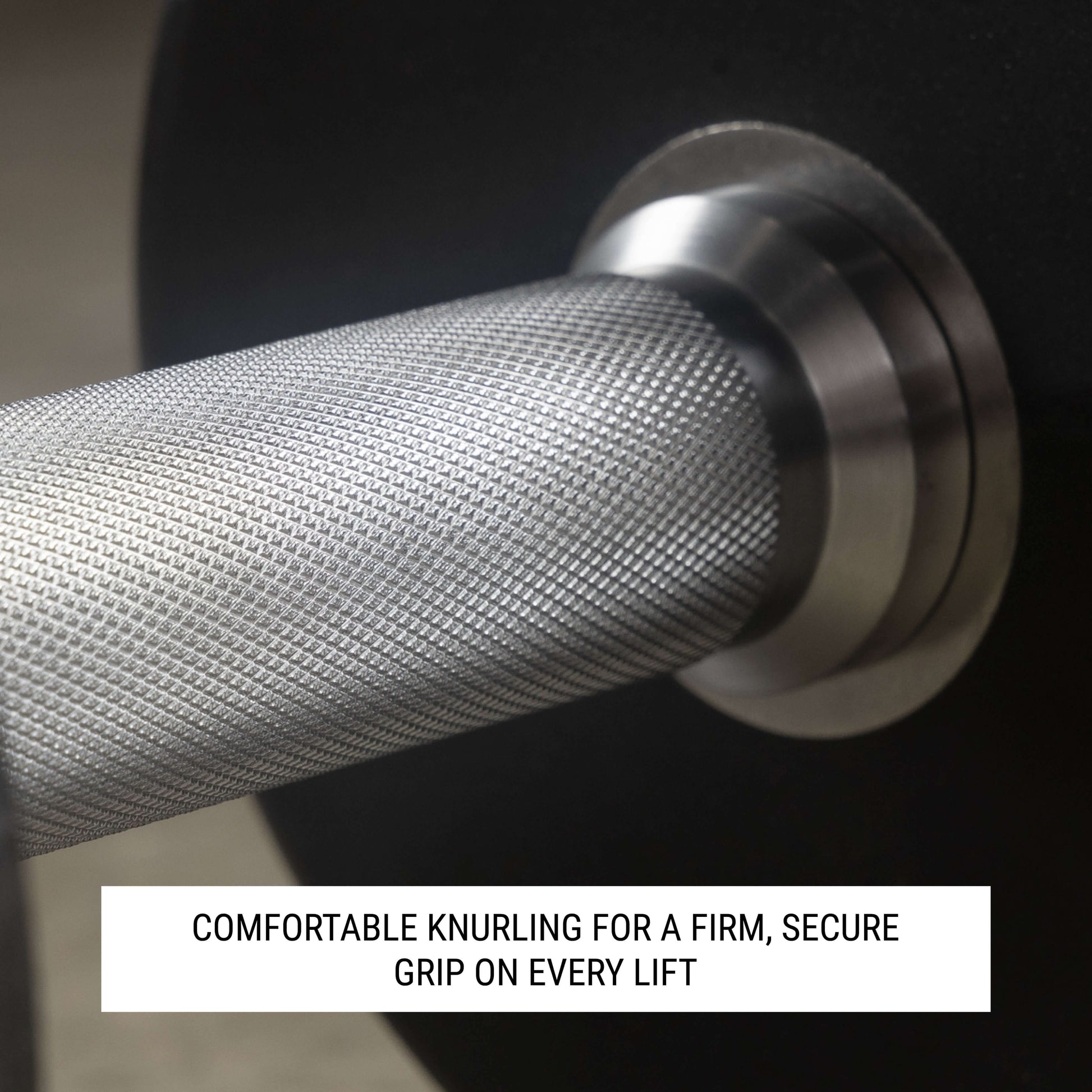 Close-up of dumbbell handle showing knurling design for a secure grip during strength training.