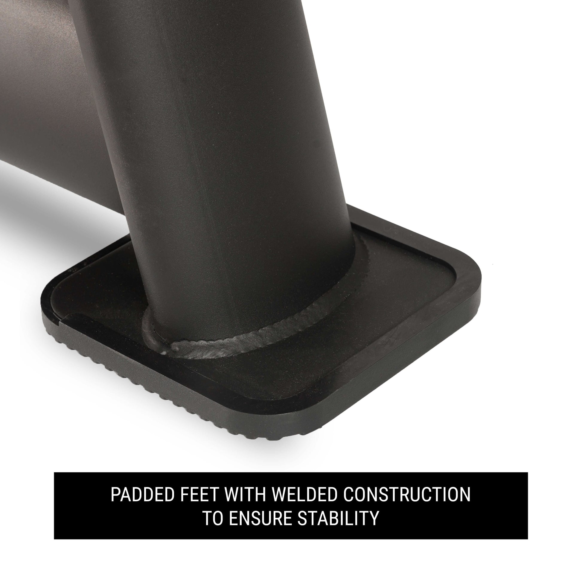 Close-up of padded feet with welded construction for stability on a commercial dumbbell rack.