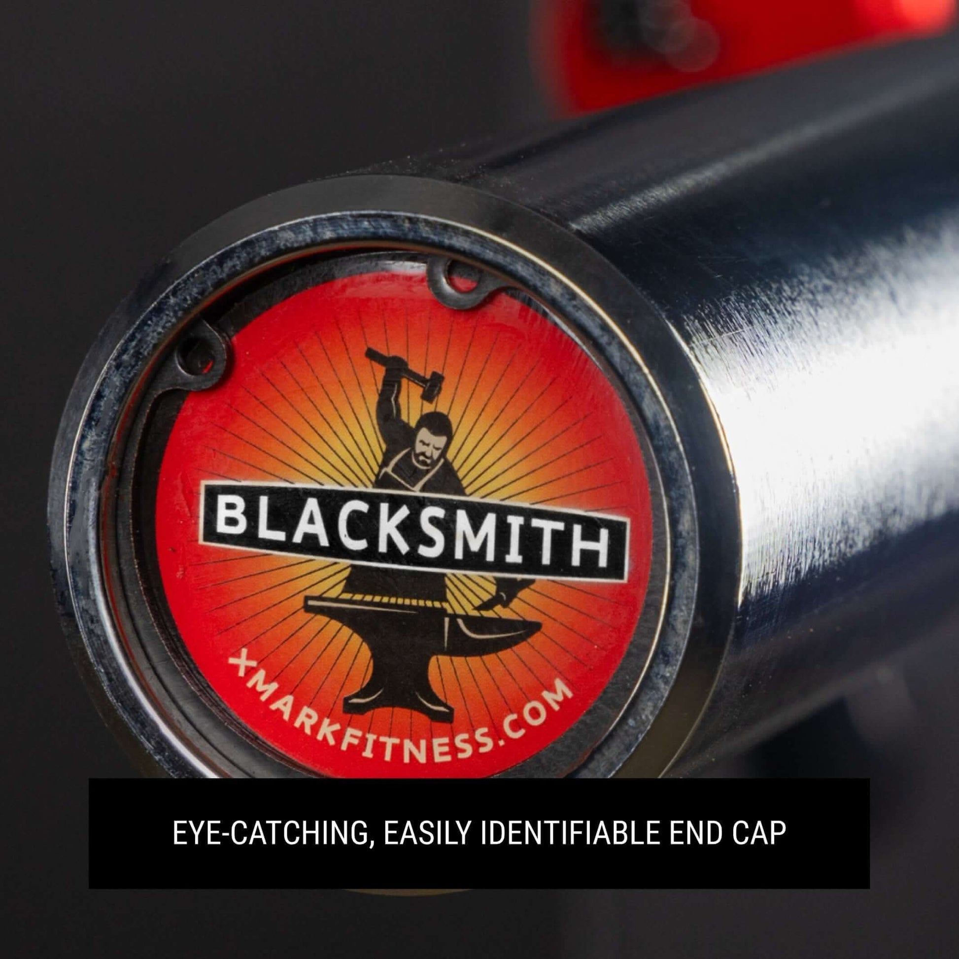 Close-up of a Blacksmith barbell end cap featuring a striking logo, showcasing its quality and brand identity.