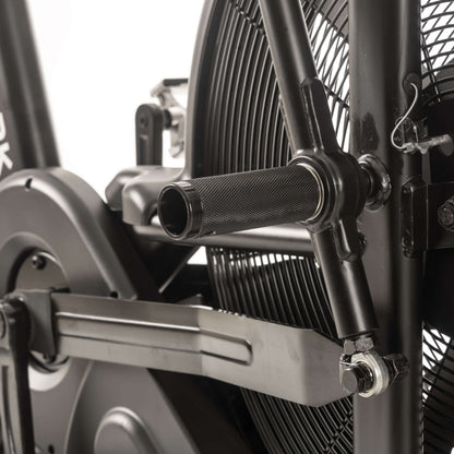 Close-up of CAT 3 Hurricane air bike's pedal system highlighting grips for total body workout engagement.