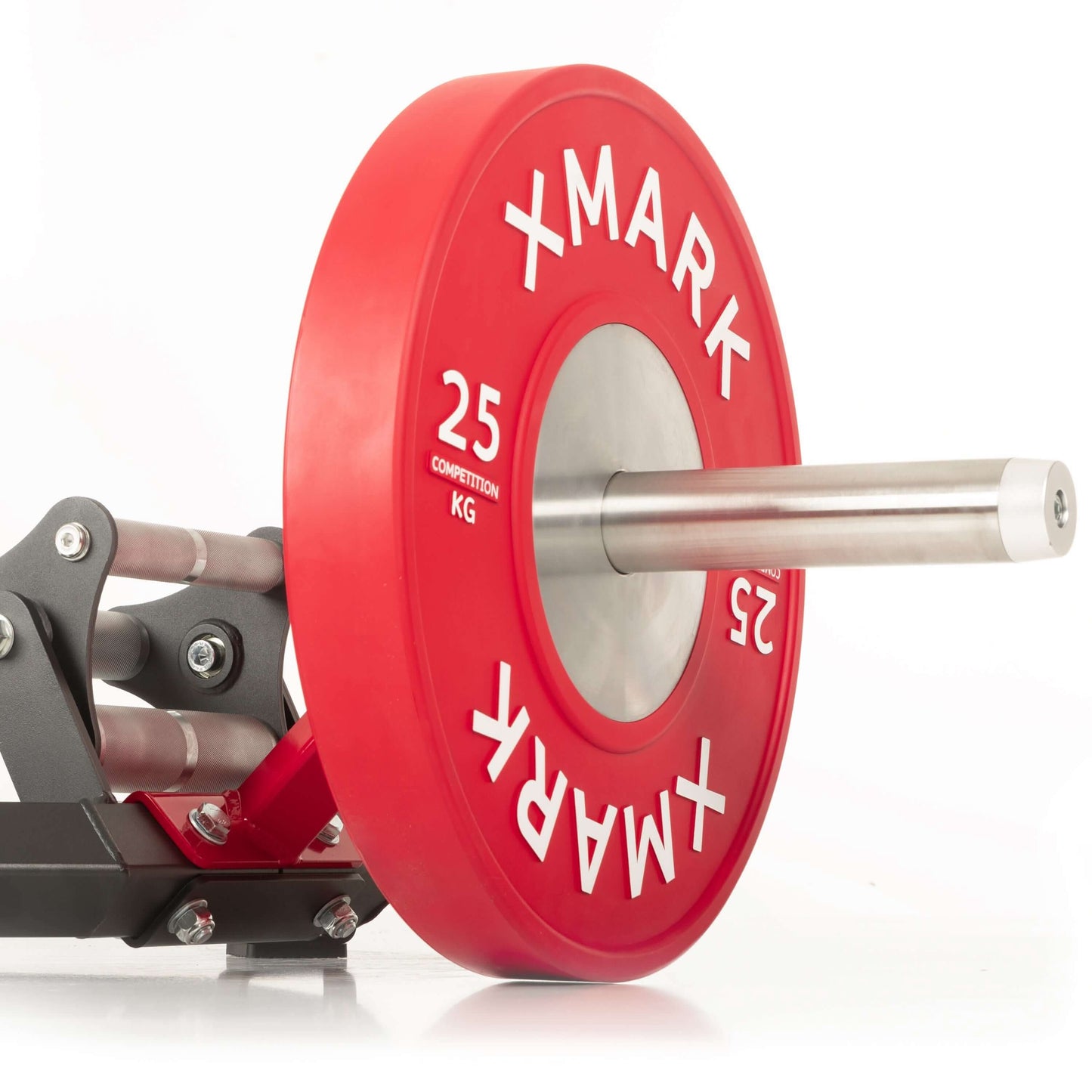Close-up of a 25 kg competition weight plate with red design, labeled 'XMARK,' attached to a barbell.